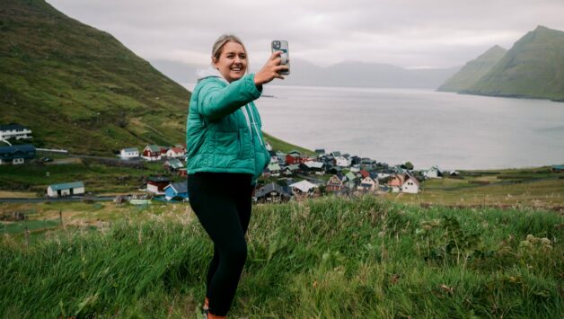 Woman taking selfie on Faroe Islands