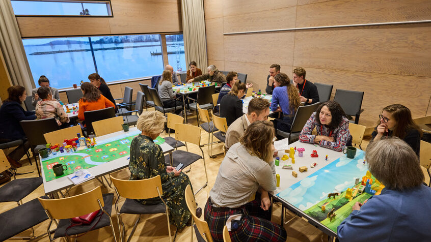 workshop participants playing the Building resilience game at Nordregio Forum