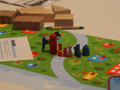 wooden blocks and play characters on a game board