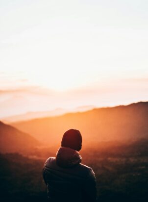 person looking into the distance photographed from behind